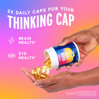 Someone pours yellow capsules from a Brain Fuel* bottle, featuring Omega-3 DHA for brain and eye health.