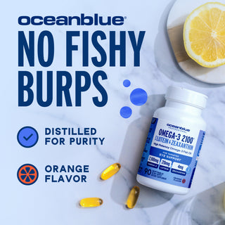 A bottle of Omega-3 2100 with Lutein & Zeaxanthin: “No Fishy Burps, Distilled for Purity, Orange Flavor,” lemon slice.