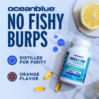 A bottle of Omega-3 2100 with Vitamin D3, capsules, lemon slice, and icons on a marble surface.